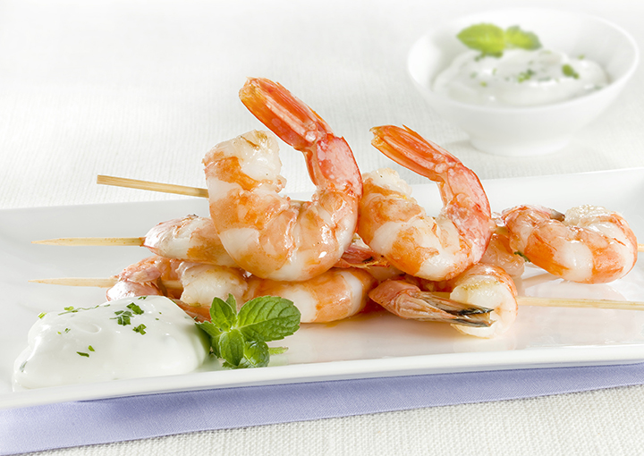 Spiedini di gamberoni con crema di squacquerone
